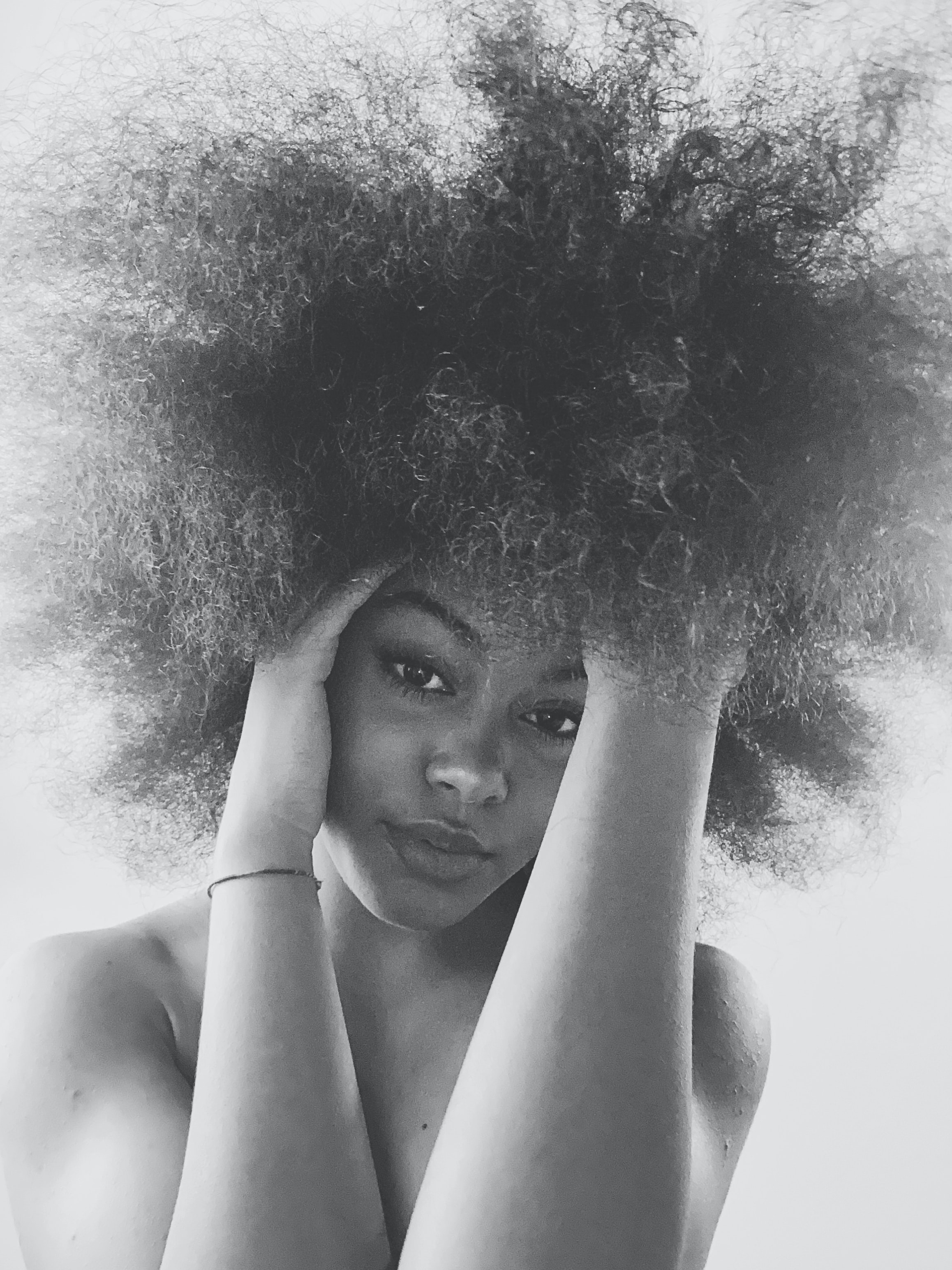 Showcase the beauty of natural summer hair with photography of models sporting stunning frizz hairstyles.